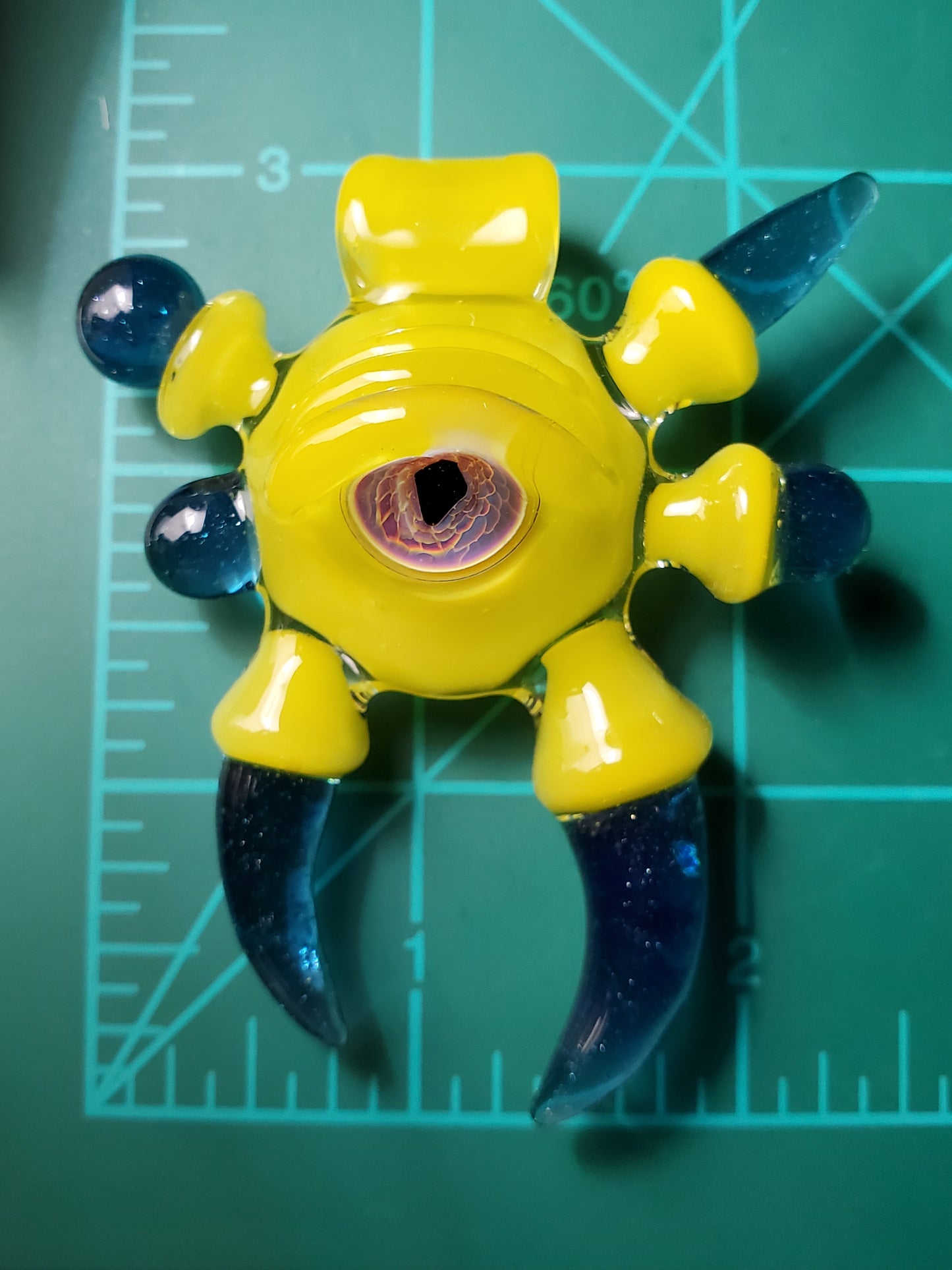 yellow/blue alien key pendant